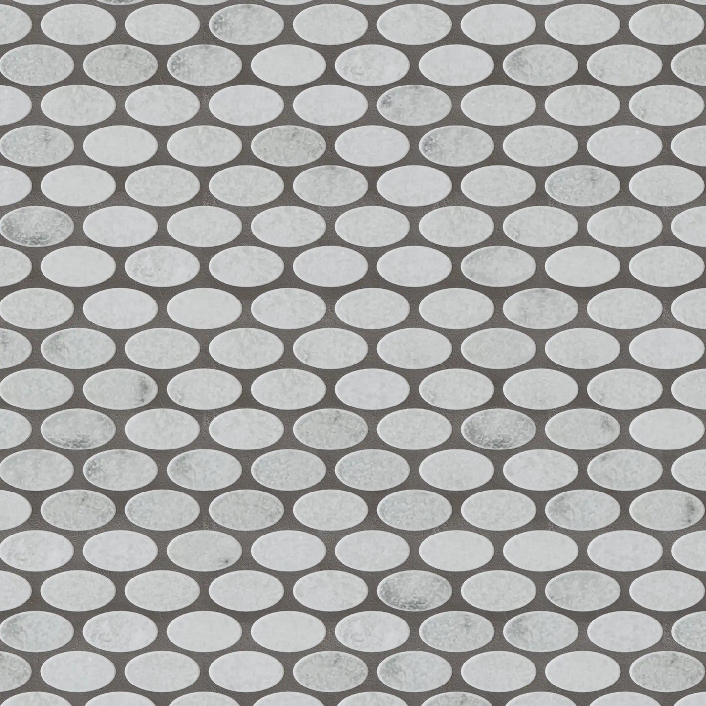 Close-up of Carrara White Tumbled Marble Ellipse Mosaic Tiles