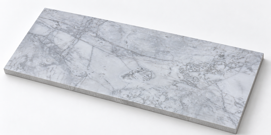 Calacatta Nimbus Cloud Honed Marble tile, angled view showing the honed face and raw sawn edges