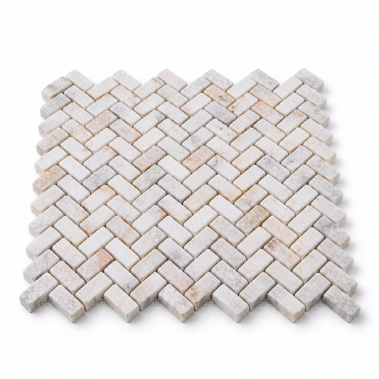 Calacatta Sugar Tumbled Marble Herringbone Mosaic Tiles – angled mosaic sheet showing natural stone edges and mesh backing.