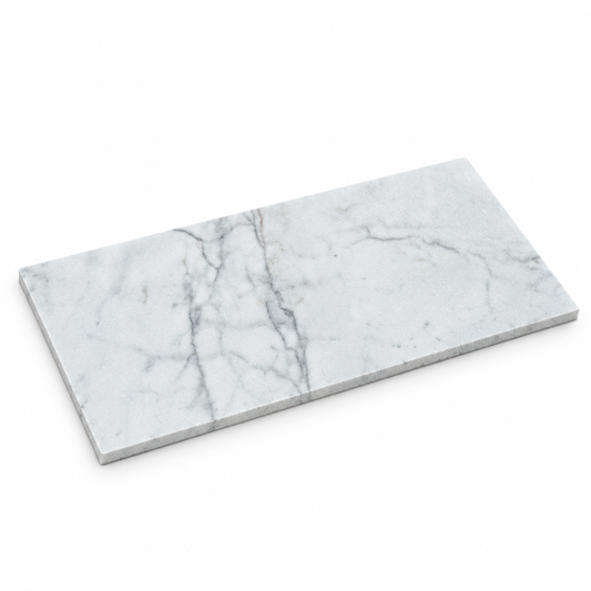 Carrara White Honed White Marble tiles: angled view showing the stone face and thin raw sawn edges