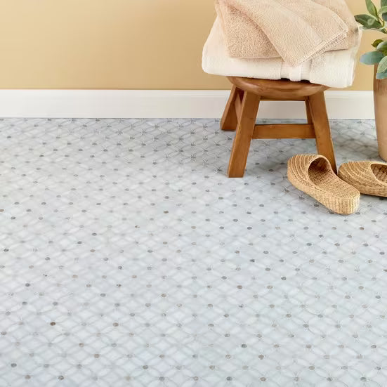 Patterned carpet with wooden stool and slippers in a room setting