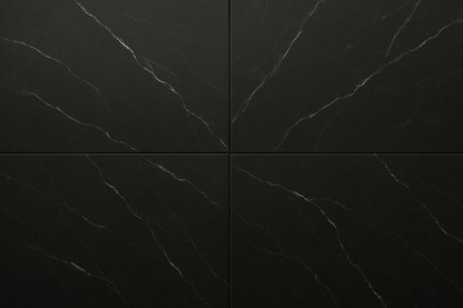 A photorealistic close-up of Nero Marquiana honed marble tiles in 305x610 mm format. The surface is smooth matte with a deep black background and fine white veining. Tiles are aligned in a modern grid layout, showing realistic grout lines. Soft natural light enhances the honed finish and luxurious texture of the marble. Ultra-realistic photography style.
