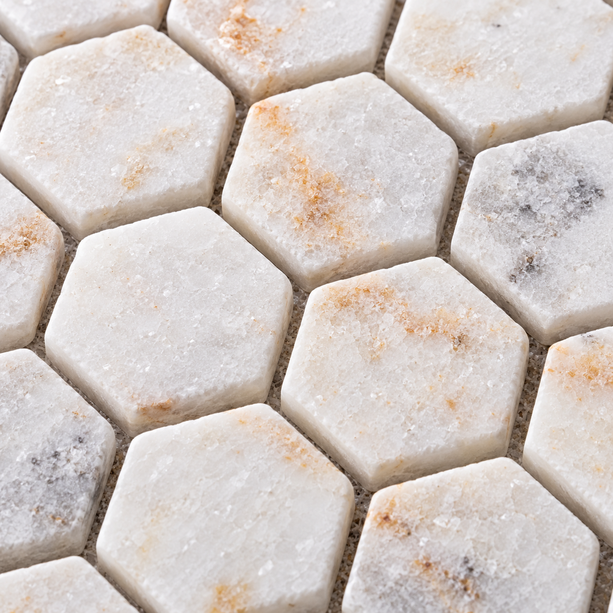 Calacatta Sugar Tumbled Marble Hexagon Mosaic Tile 23x23 – close-up of the stone surface and mosaic joints.