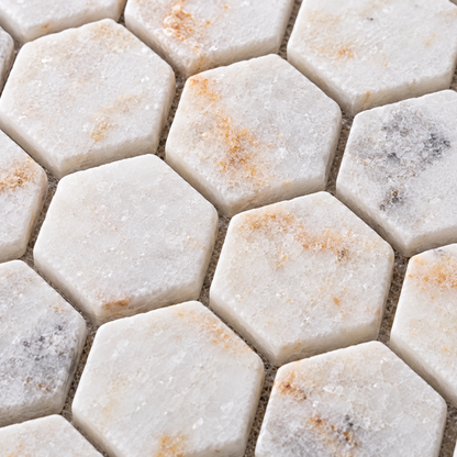 Calacatta Sugar Tumbled Marble Hexagon Mosaic Tile 23x23 – close-up of the stone surface and mosaic joints.