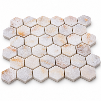 Calacatta Sugar Tumbled Marble Hexagon Mosaic Tiles 48x48 – angled mosaic sheet showing natural stone edges and mesh backing.