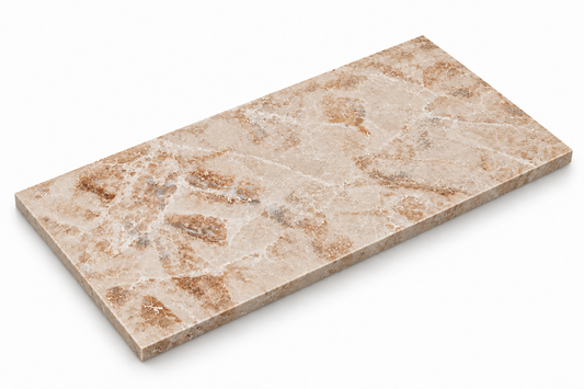 Cappuccino polished marble tile showing cream and caramel veining and sawn stone edges, angled view