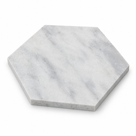 Carrara White Honed Marble Hexagon tiles: angled view showing the stone face and raw sawn edges