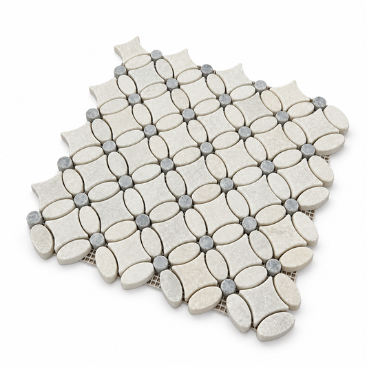 Carrara White and Platinum Grey tumbled marble flower mosaic — angled side view showing stone thickness and mesh backing