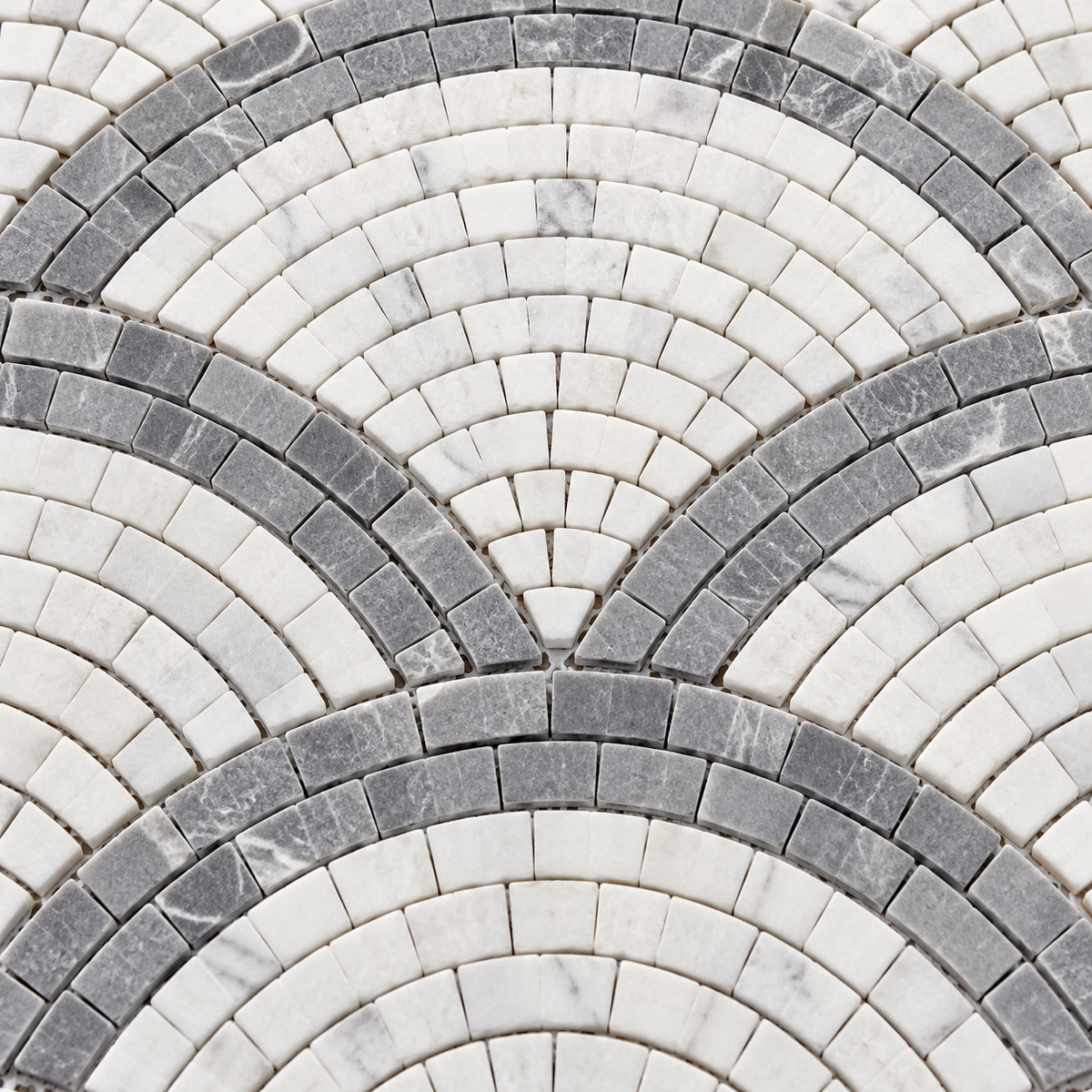 Carrara White and Platinum Grey Fan / Scallop Honed Marble Mosaic Tile — close-up of the natural marble texture and chip layout