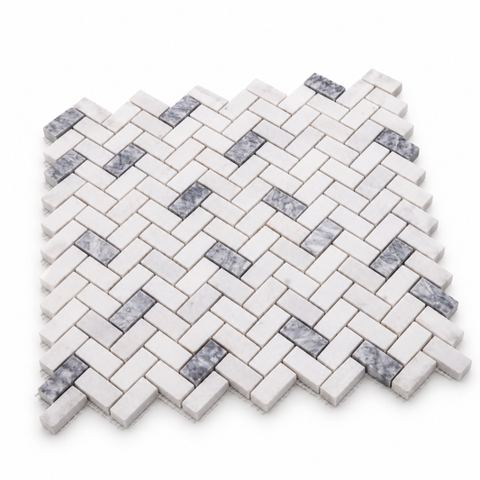 Carrara White - Platinum Grey Honed Marble Herringbone Mosaic Tiles — angled sheet showing natural marble edges and mesh backing