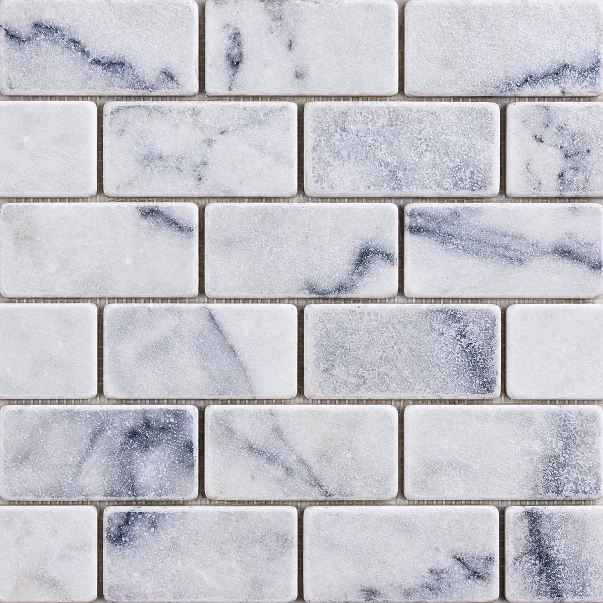 Carrara White Tumbled Marble Brick Mosaic Tile 50x100 — close-up of natural marble texture, finish and chip pattern
