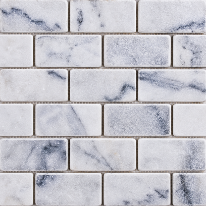 Carrara White Tumbled Marble Brick Mosaic Tile 50x100 — close-up of natural marble texture, finish and chip pattern