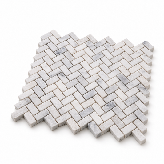 Carrara White Tumbled Marble Herringbone Mosaic Tiles — angled sheet showing 10 mm marble edges and mesh backing