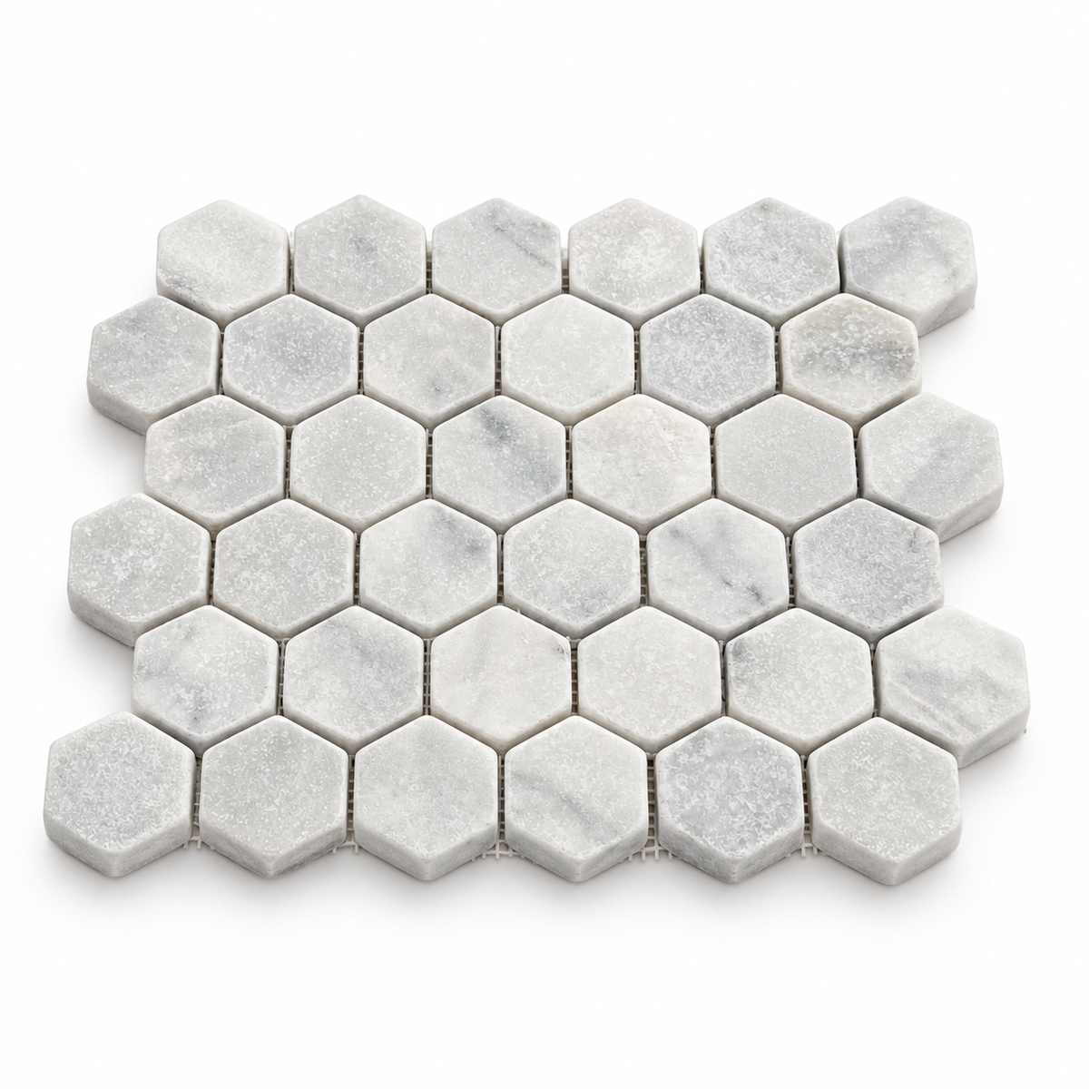 Carrara White Tumbled Marble Hexagon Mosaic Tile 48x48 — angled sheet showing 10 mm marble edges and mesh backing