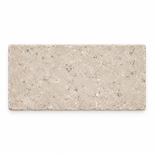 Dijon tumbled limestone paving cobble, 200 x 100 mm, front view showing natural mineral markings