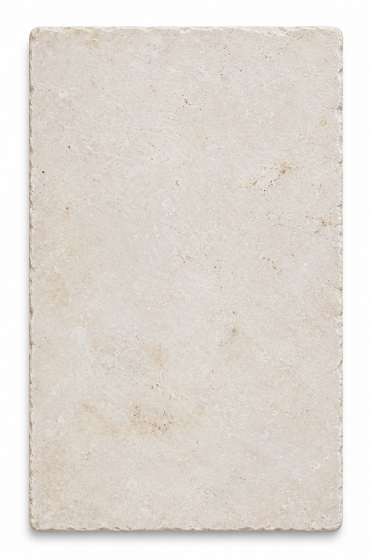 Galala Ivory Light Cream tumbled limestone 600 x 400 mm tile viewed from above, showing softly aged edges and natural markings.