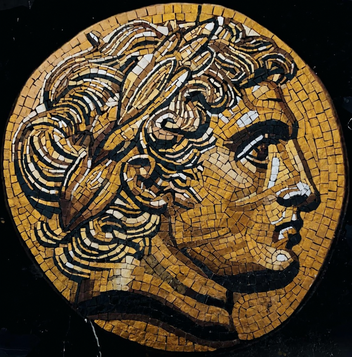 The Golden Laureate natural stone mosaic portrait with a laurel wreath on a dark background