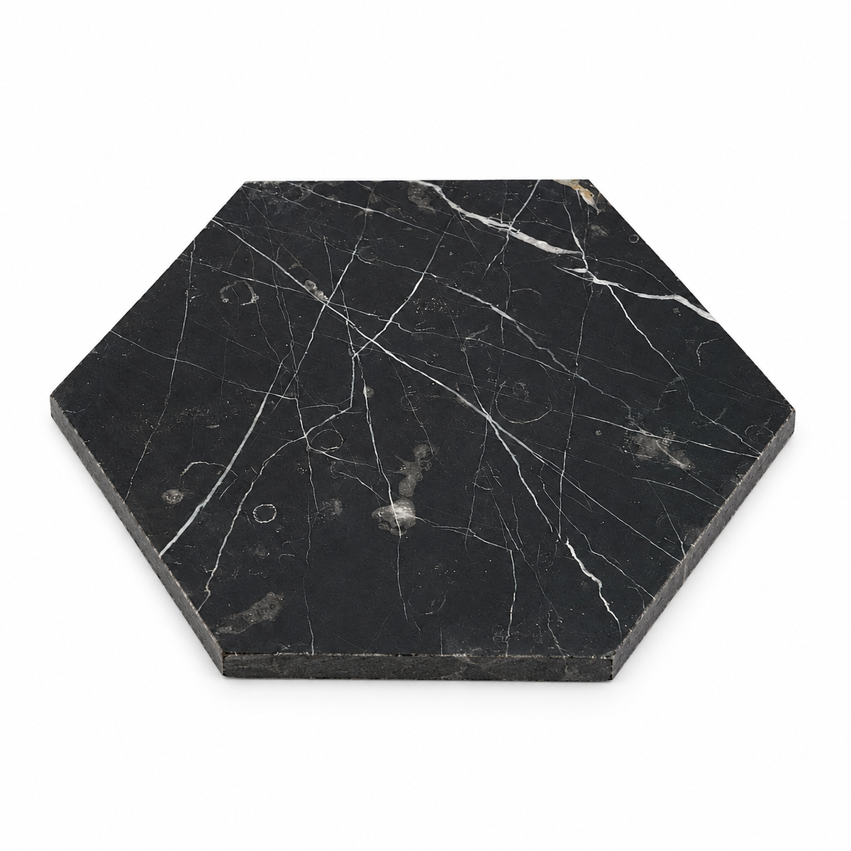 Nero Marquina Honed Hexagon Marble Wall & Floor Tiles: angled view showing natural stone face and thin raw sawn edges