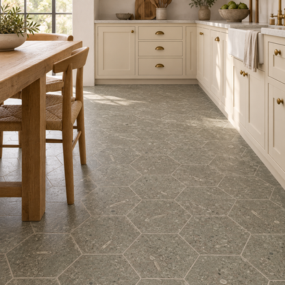 Rustic Green honed limestone hexagon floor tiles in a cream and oak kitchen