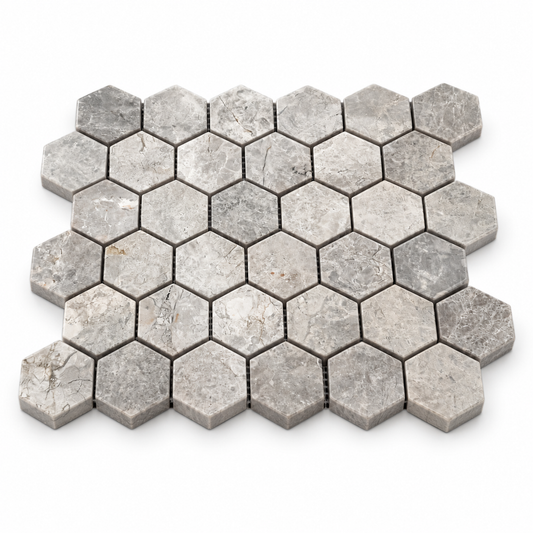 Silver Shadow Hexagon Polished Marble Hexagon Mosaic 48x48 — angled sheet showing natural stone edges and mesh backing