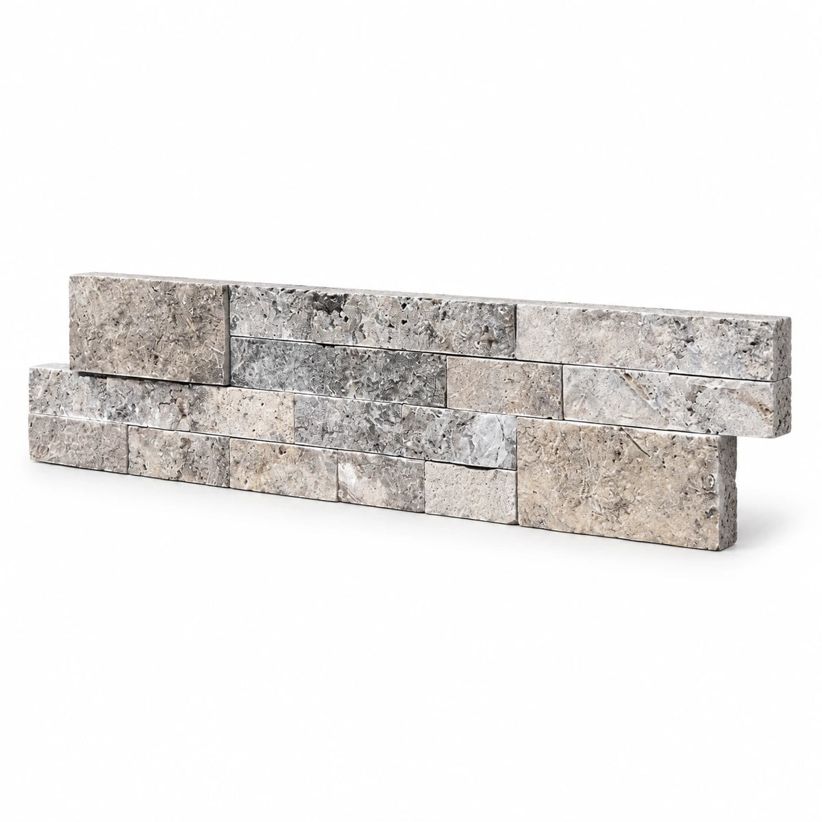 Angled view of a silver travertine split face ledger panel with stepped ends on a white background.