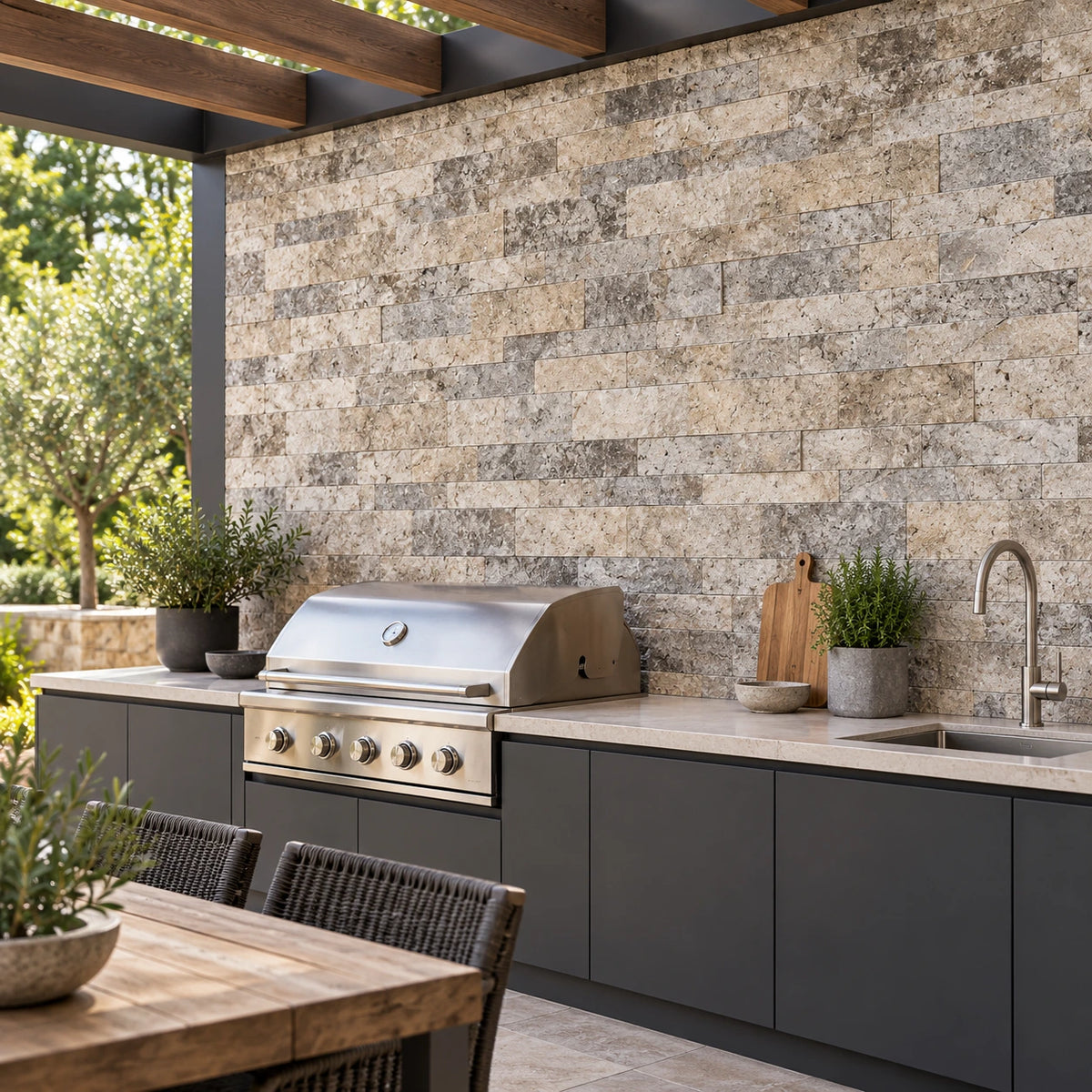 Silver Travertine split face wall cladding behind a barbecue and sink in a sheltered outdoor kitchen visualisation.